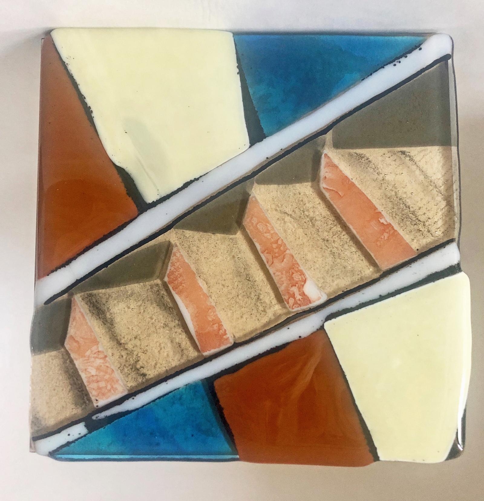 Fused and powdered glass mounted on wood