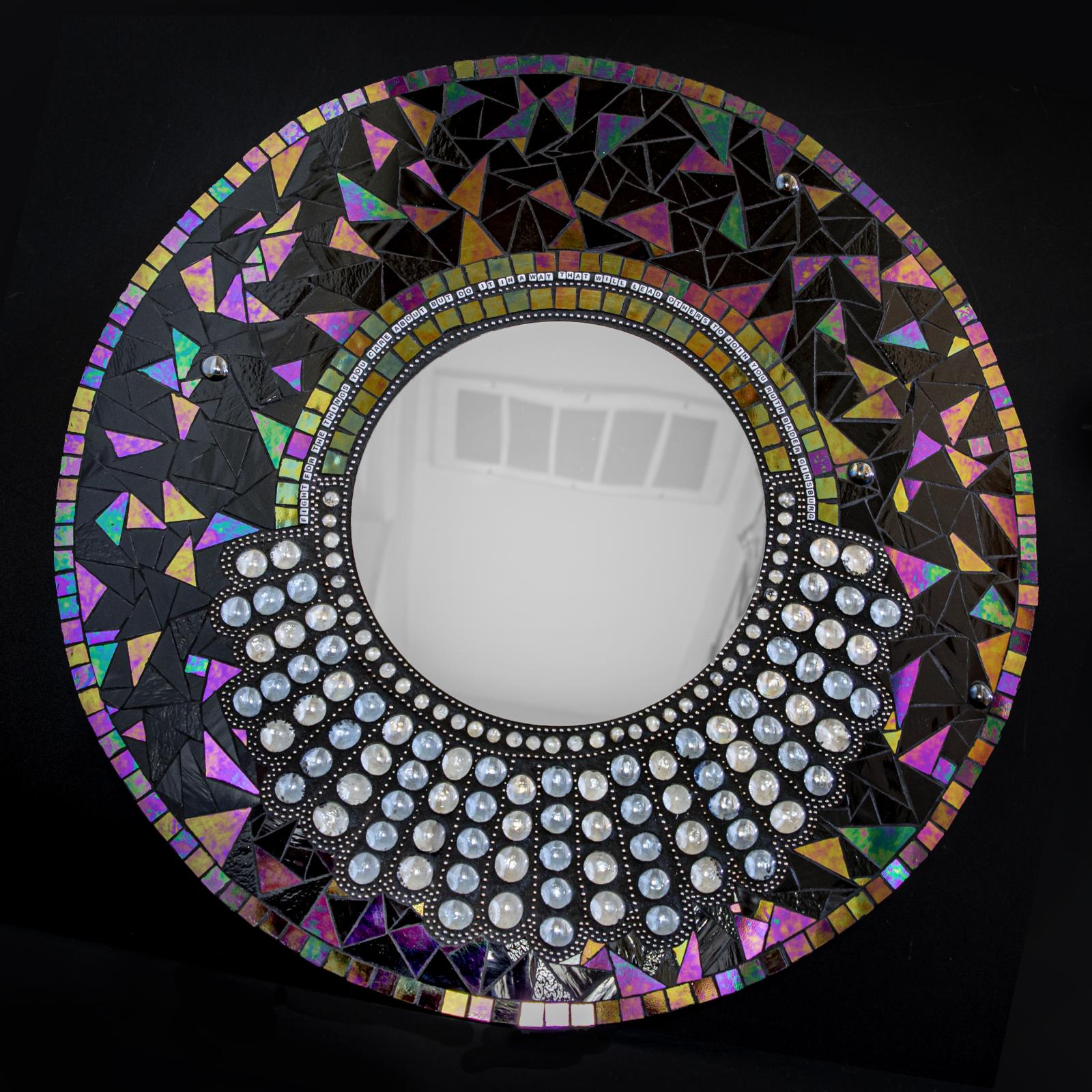 My homage to the great Ruth Bader Ginsberg. 24" round mosaic with 10" mirror in the center. RBG's famous dissent collar created in glass and steel beads. SOLD