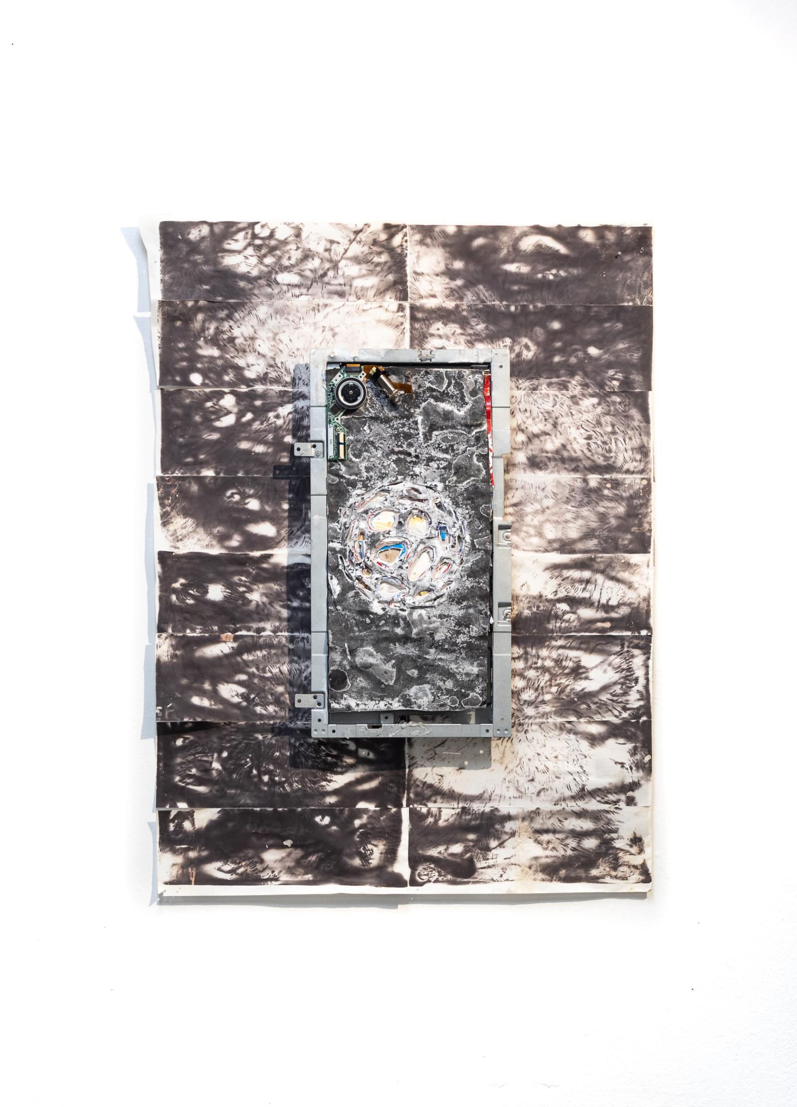 Found object assemblage and emergent illustration. Layers of found paper products were packed into a monitor piece, carved, and crystallized, before being mounted on heat stamped receipt paper