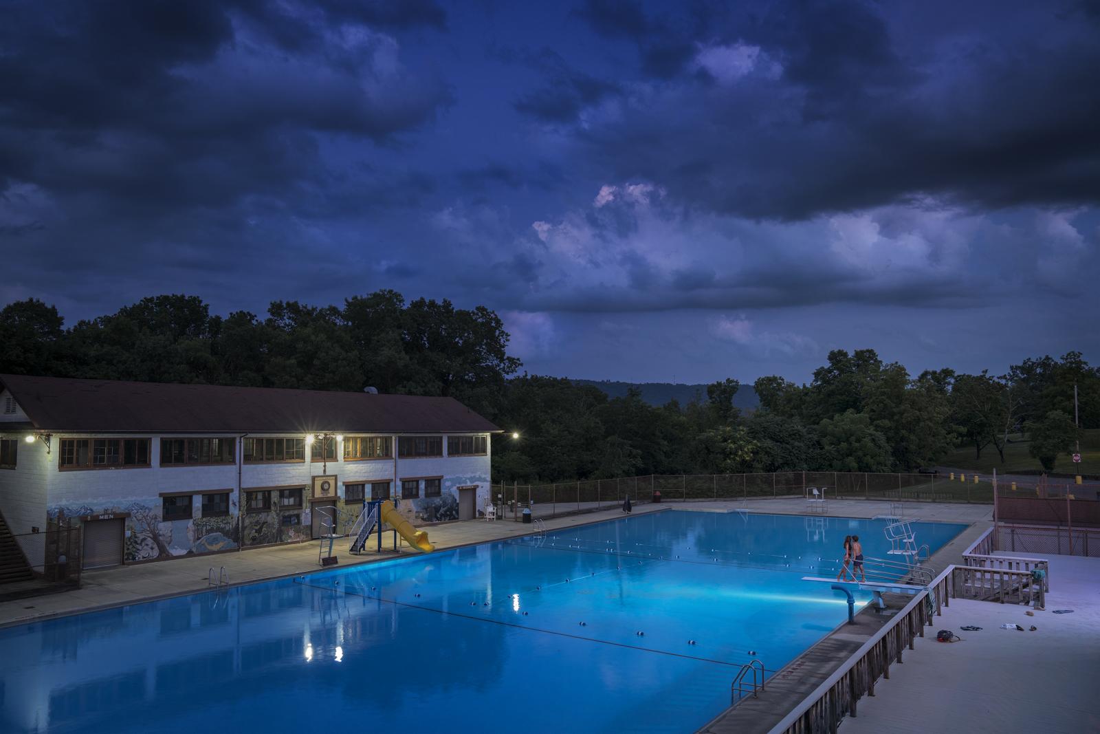 Staged photograph at a public swimming pool (Constitution Park Pool) in Cumberland, MD.