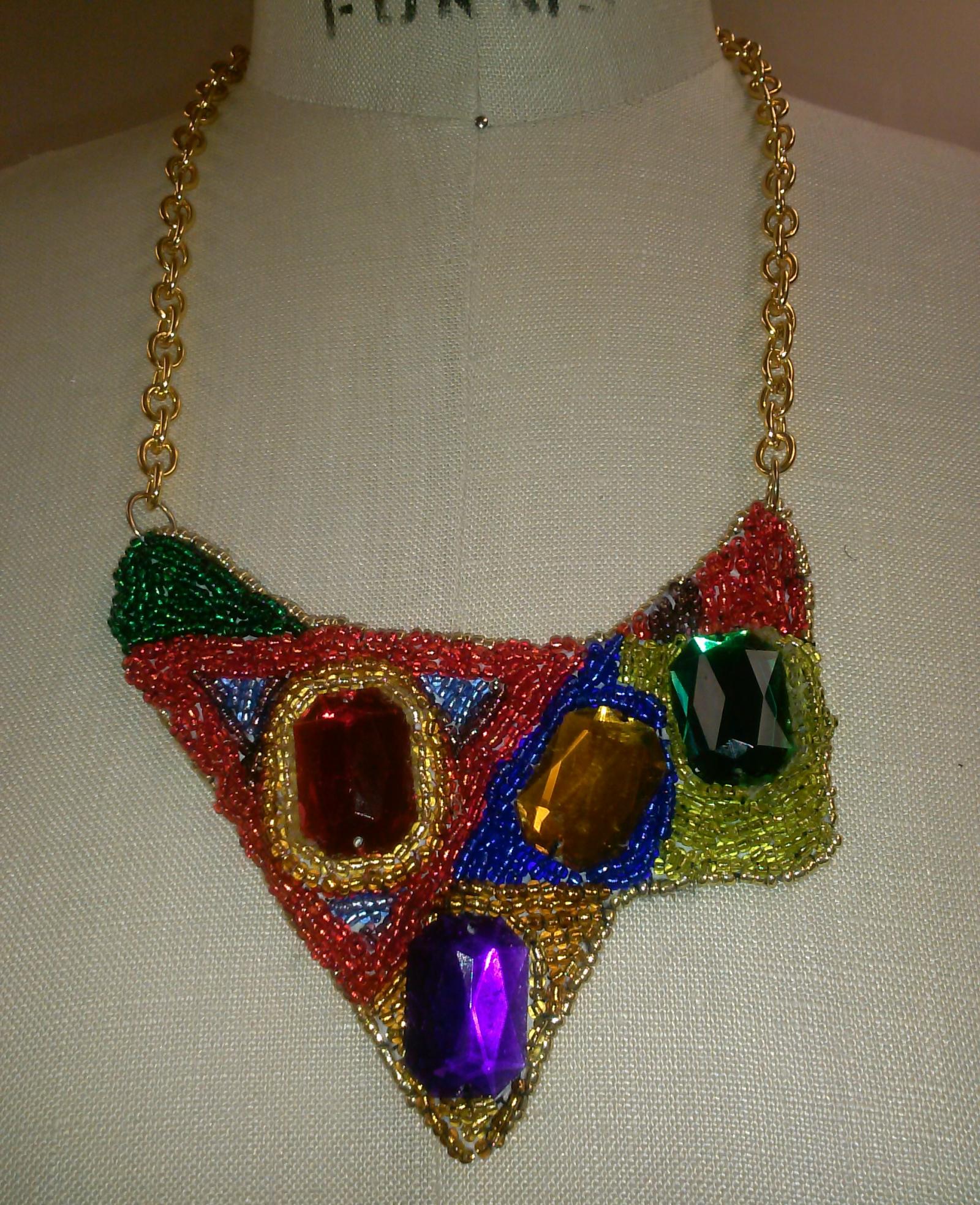 A custom beaded embroidery necklace with a cold chain.