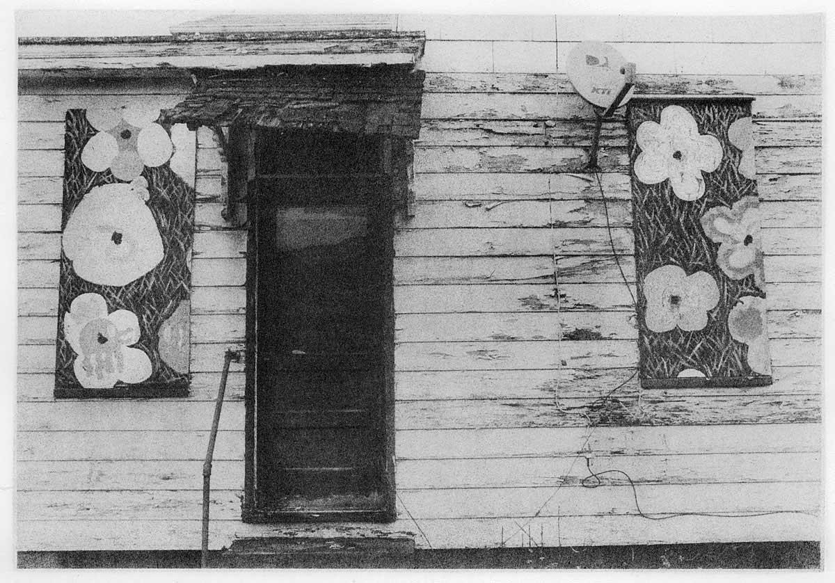 There are plenty of buildings that are marked to be taken down in Braddock, and this is done by painting a number on the door.  I am not sure whether this particular house is to be destroyed, but the shuttered windows have been painted in such a way that brings a smile.  This has been done to several houses in the area, and I am unsure who did this and whether it has more meaning than a blank canvas having been available.